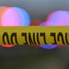 Police tape is strung up with police sirens flashing in the background - © John Oliva/Caller-Times / USA TODAY NETWORK