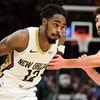 Antonio Reeves drives to the bucket for the Pelicans, via Imagn Images