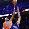 Jan 3, 2025; Oklahoma City, Oklahoma, USA; Oklahoma City Thunder guard Shai Gilgeous-Alexander (2) shoots as New York Knicks center Karl-Anthony Towns (32) defends during the second half at Paycom Center. Mandatory Credit: Alonzo Adams-Imagn Images