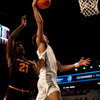 Cincinnati Bearcats guard Dan Skillings Jr. (0) dunks as Arizona State Sun Devils forward Jayden Quaintance (21) defends in the second half of the NCAA basketball game at Fifth Third Arena in Cincinnati on Saturday, January 18, 2025. © Albert Cesare/The Enquirer / USA TODAY NETWORK via Imagn Images