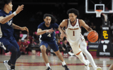 USC Trojans guard Desmond Claude (1) dribbles the ball against Penn State Nittany Lions guard Freddie Dilione V (4) and forward Zach Hicks (24) in the second half at Galen Center