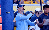 West Virginia defensive coordinator Zac Alley calls the play