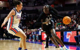 Jan 4, 2026; Gainesville, Florida, USA; South Carolina Gamecocks guard Agot Makeer (44) shoots the ball at Florida Gators guard Emilija Dakic (7) during the first half at Exactech Arena at the Stephen C. O'Connell Center. Mandatory Credit: Matt Pendleton-Imagn Images
