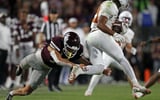Oct 25, 2025; Starkville, Mississippi, USA; Texas Longhorns wide receiver/running back Ryan Niblett (21) returns a punt as he breaks a tackle attempt by Mississippi State Bulldogs defensive back Cyrus Reyes (19) during the fourth quarter at Davis Wade Stadium at Scott Field. Mandatory Credit: Petre Thomas-Imagn Images