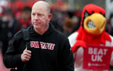 Louisville’s Jeff Brohm walks during the Card March before the game before Kentucky in the Governor’s Cup. November 29, 2025