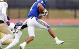 Stillwater's David Thomas gets by Choctaw's Kentrell Gaddis II on the way to a touchdown during the Class 6A II semifinal