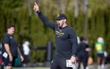 Oregon tight ends coach Drew Mehringer works with players during practice with the Ducks Thursday, April 11, 2024, at the