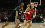 Aug 15, 2026; Washington, District of Columbia, USA; Los Angeles Sparks guard Tonie Morgan (4) drives to the basket as Washington Mystics guard Alicia Florez (2) defends in the first half at CareFirst Arena. Mandatory Credit: Geoff Burke-Imagn Images