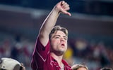 A Florida State fan holds up a thumbs down signal while yelling ìbooî at Florida State Seminoles head coach Mike Norvell after