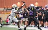 Avon Orioles Chris Livingston (9) attempts to stop Brownsburg Bulldogs Branden Sharpe (12) on Friday, Sept. 11, 2026, during a