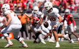 Texas Longhorns quarterback Arch Manning (16) runs during the second half of the NCAA football game against the Ohio State