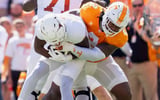 Sep 26, 2026; Knoxville, Tennessee, USA; Tennessee defensive lineman Xavier Gilliam (2) takes down Texas running back Derrek Cooper (5) during a college football game between Tennessee and Texas at Neyland Stadium in Knoxville, Tenn. on Sept. 26, 2026. Mandatory Credit: Brianna Paciorka-USA TODAY Network via Imagn Images