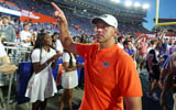 Florida head coach Jon Sumrall reacts to fans after Florida beat Ole Miss 52-28 after the second half an NCAA football game