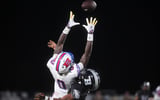 Bartletts Pierce Washington (0) jumps to catch a pass for a first down during the game between Bartlett High School and Houston