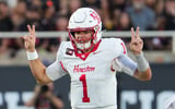 Houston's Conner Weigman gestures at the line of scrimmage against Texas Tech during a Big 12 Conference football game, Friday,