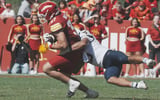 Iowa State tight end Vince Benetti (37) battles for extra yardage as he is tackled by West Virginia linebacker Cam Torbor (13)