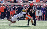 OSU wide receiver Wyatt Young (10) runs the ball and is taken down by UCF defensive back Braeden Marshall (4) in the first