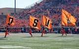 Flags are flown in the first quarter during an NCAA football game between the Oklahoma State University (OSU) Cowboys and the