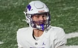 Brownsburg Bulldogs Oscar Frye (18) looks to pass Friday, Aug. 21, 2026, during a game at Lawrence North High School in