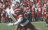 Iowa State defensive tackle Bryson Lamb (99) attempts to bring down West Virginia quarterback Michael Hawkins Jr. (3) during the