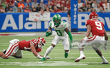 SAN ANTONIO, TX - DECEMBER 29: Seven McGee #0 of the Oregon Ducks looks for running room against the Oklahoma Sooners in the Valero Alamo Bowl at the Alamodome on December 29, 2021 in San Antonio, Texas. (Photo by Ronald Cortes/Getty Images)