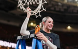 South Carolina Gamecocks forward Chloe Kitts (21) cuts the net after the win over Texas in the SEC women’s championship at Bon Secours Wellness Arena. Mandatory Credit: Jim Dedmon-Imagn Images