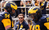 Michigan Wolverines football offensive lineman Andrew Sprague and quarterback Bryce Underwood celebrate after a touchdown in a 63-3 win over Central Michigan. (Photo by Junfu Han / USA TODAY NETWORK via Imagn Images)