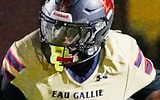 XZavier Corbin of Eau Gallie tries to get around Lemeul Bass of Bishop Moore in the regional finals of the Class 3A football