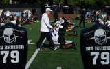 Vanderbilt Chief Consultant to the Head Coach/Senior Offensive Advisor Jerry Kill takes in stretching exercises during football