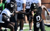 Vanderbilt wide receiver Junior Sherrill (0) runs a route against cornerback Cayden Daniels (26) during fall practice Wednesday,