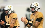 Vanderbilt quarterbacks Blaze Berlowitz (1) and Jared Curtis (2) go through drills during preseason practice at the schools
