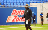 Head coach Charles Huff looks on as the Memphis Tigers football team held an open practice and signed autographs for fans