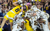 Michigan wide receiver JJ Buchanan (6) catches for a touchdown against Western Michigan to win the game 13-12 as time expires during the second half at Michigan Stadium in Ann Arbor on Saturday, Sept. 5, 2026.
