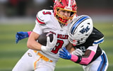 Big Walnut's Nolan Buirley (3) runs after the catch while Worthington Kilbourne's Creed Gaiters II makes the stop Oct. 3, 2025,