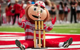 Brutus Buckeye sits with his UCA national championship trophy during the NCAA football game between the Ohio State Buckeyes and
