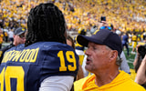 Michigan Wolverines football quarterback Bryce Underwood and head coach Kyle Whittingham after beating Oklahoma. (Photo by USA TODAY Network via Reuters Connect)