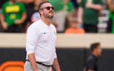 Oregon head coach Dan Lanning takes in the rain as the Oregon Ducks face the Oklahoma State Cowboys on Sept. 12, 2026, at Boone