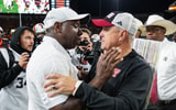 Oregon State head coach JaMarcus Shepard, left, and Texas Tech head coach Joey McGuire embrace after the NCAA football game at