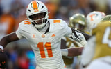Sep 12, 2026; Atlanta, Georgia, USA; Tennessee Volunteers quarterback Faizon Brandon (11) avoids a defender against the Georgia Tech Yellow Jackets in the first quarter at Bobby Dodd Stadium at Hyundai Field. Mandatory Credit: Brett Davis-Imagn Images