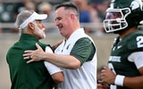 Michigan State Spartans head coach Pat Fitzgerald shakes hands with Eastern Michigan Eagles head coach Chris Creighton after the game at Spartan Stadium. - Dale Young, USA TODAY Sports