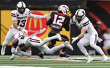 Oregon State's Jesse Legree (12) attempts to evade tackles from Texas Tech defenders during an NCAA football game at Reser