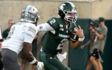 Michigan State Spartans quarterback Cam Fancher (2) sprints for a first down during the fourth quarter against the Eastern Michigan Eagles at Spartan Stadium. - Dale Young, USA TODAY Sports
