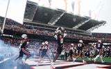 Oregon State players run onto the field before facing Texas Tech during an NCAA football game at Reser Stadium on Saturday,