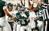 Michigan State’s Charles Brantley, center, looks to see if referees grant him an interception on a play against Toledo’s Daryl Barnett Jr. during the second quarter on Friday, Sept. 4, 2026, at Spartan Stadium in East Lansing. - Nick King, USA TODAY Sports