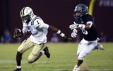 Springfields Jermaine Cobbins (1) attempts to evade a tackle by Station Camps Luca Gilbert (15) during their game at Station