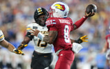 Kansas Jayhawks quarterback Isaiah Marshall (8) throws the ball against Missouri Tigers during the game inside David Booth