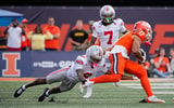 Ohio State Buckeyes cornerback Devin Sanchez (6) tackles Illinois Fighting Illini wide receiver Collin Dixon (17) during the