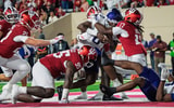 Indiana's Tyrique Tucker (95), Rolijah Hardy (5) and Daniel Ndukwe (17) tackle Northwestern's Aiden Chiles (0) for a safety