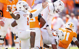 Texas edge Colin Simmons (1) celebrates after Tennessee quarterback Faizon Brandon (11) is sacked again during a college