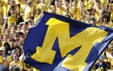 Michigan fans flag tunnel banner The Big House